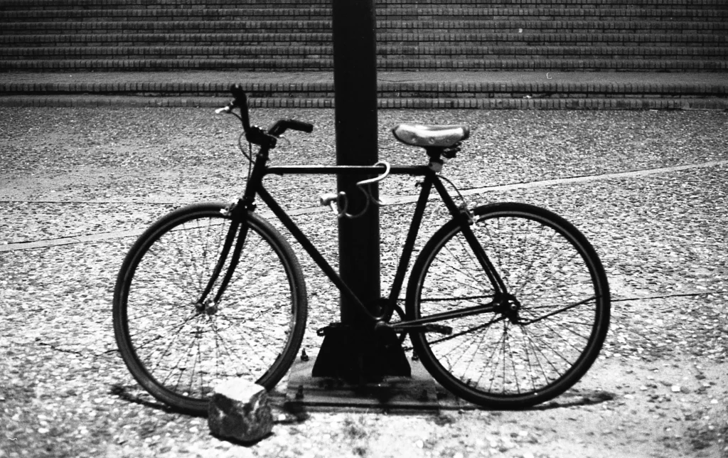 bike shackled to a lamppost