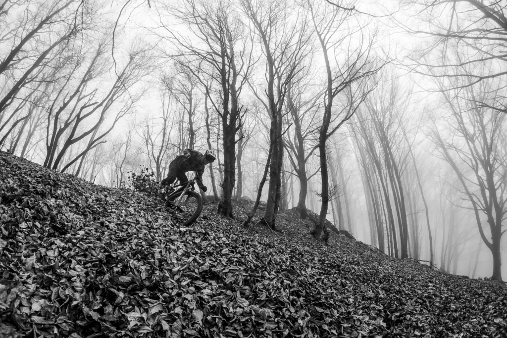 man riding an ebike down a hill